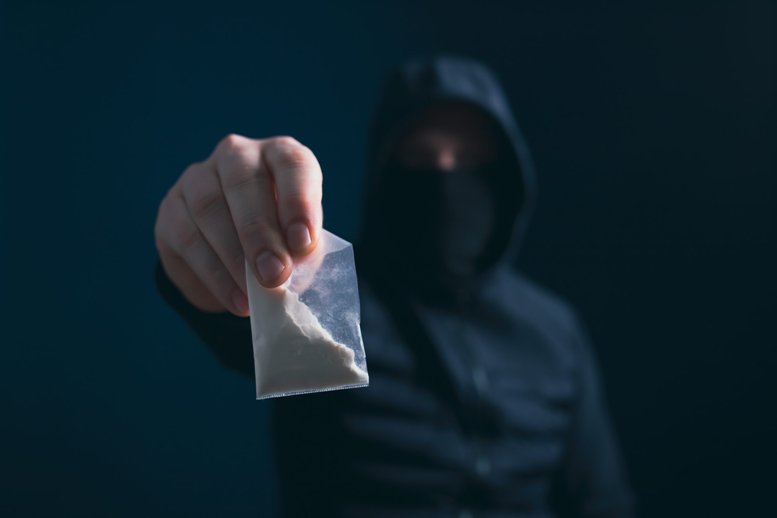 Hand,of,addict,man,holding,a,dose,of,cocaine,or